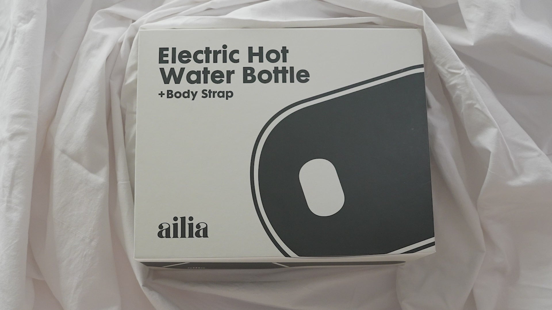 The Ailia Electric Hot Water Bottle + Body Strap being worn in various public settings.